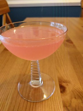 Pink cocktail in a coupe glass