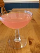 Pink cocktail in a coupe glass